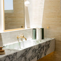 Three Bernie ceramic vases sitting on a bathroom sink