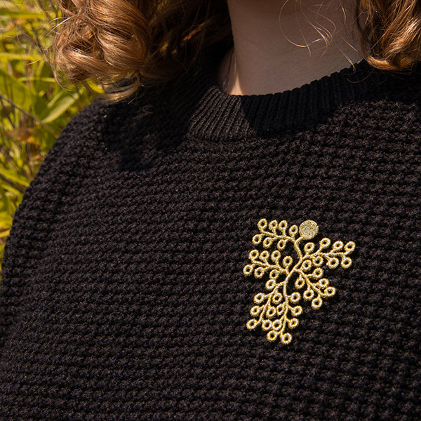Golden spikemoss brooch