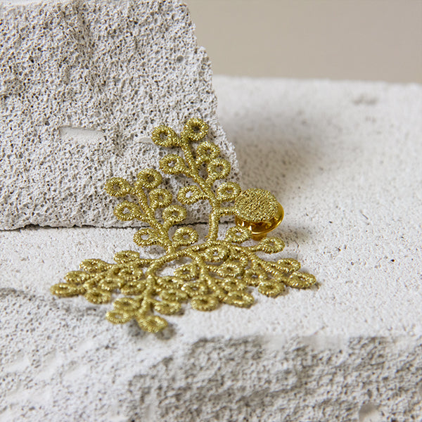 Golden spikemoss brooch
