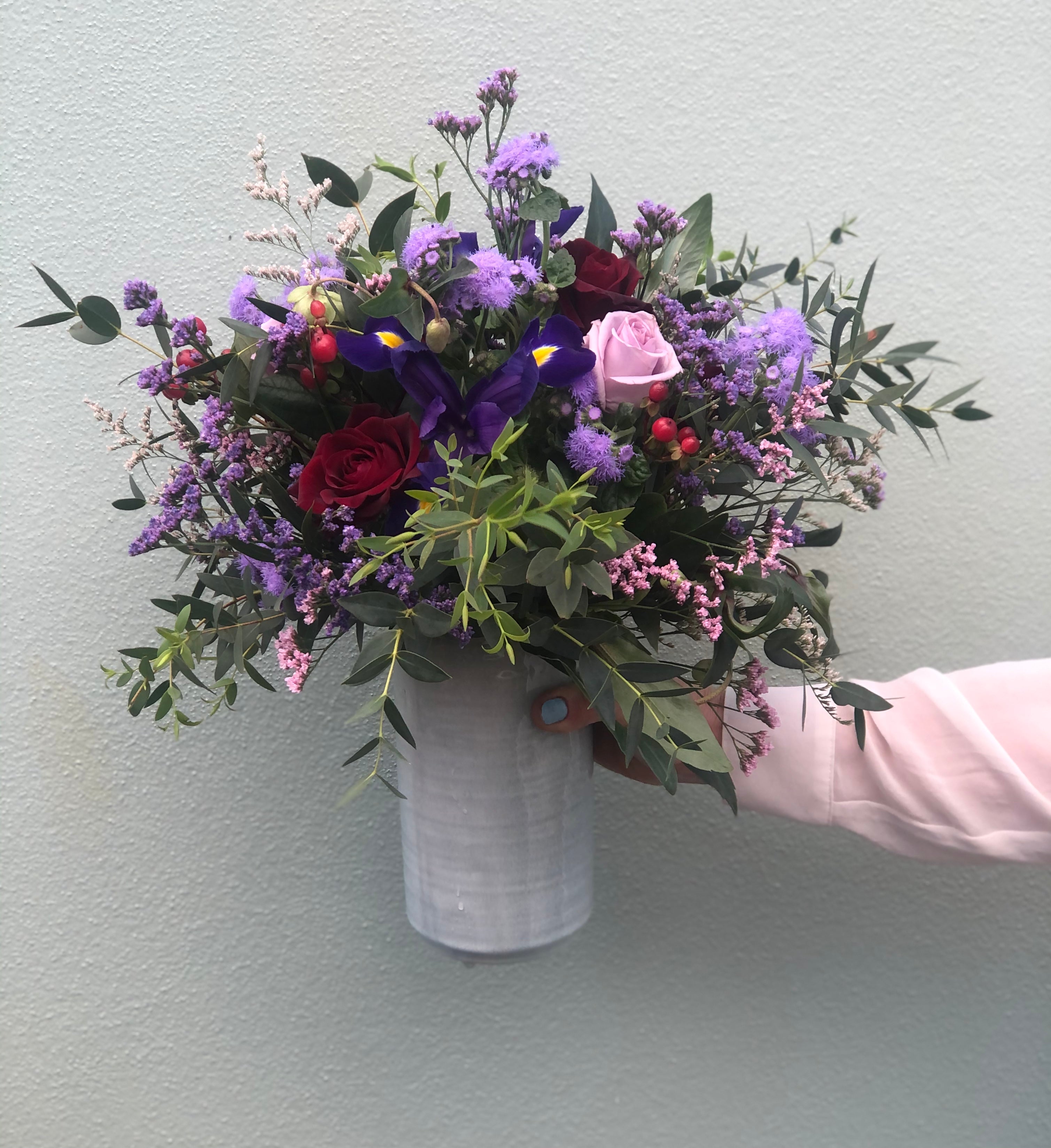 Fresh flower arrangement in a ceramic vase